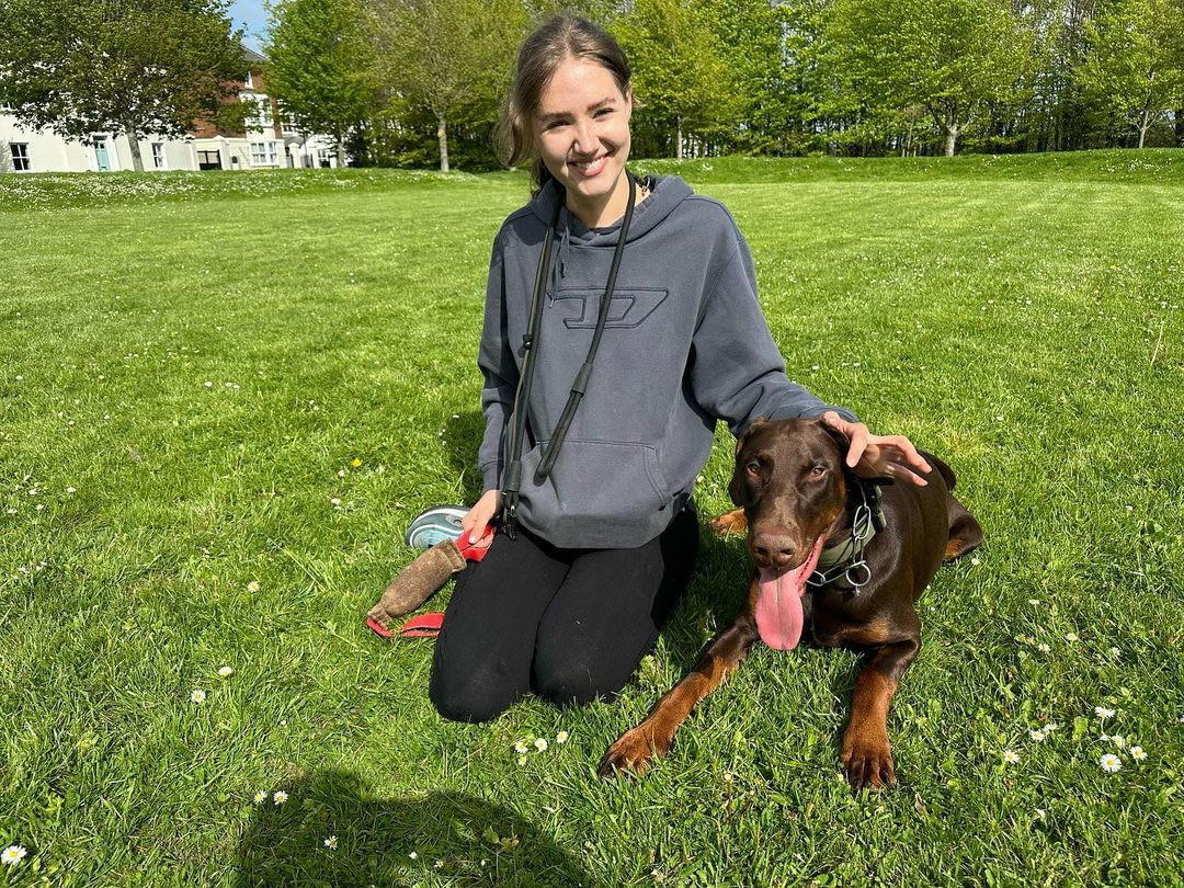 Beatrice and her 10 month old male Dobermann Ares